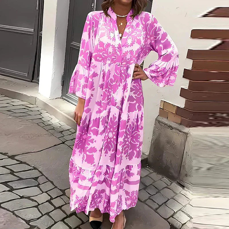 Elegant women's maxi dress with ornate baroque print, stylish lantern sleeves, V-neckline, and a beautiful tiered skirt.