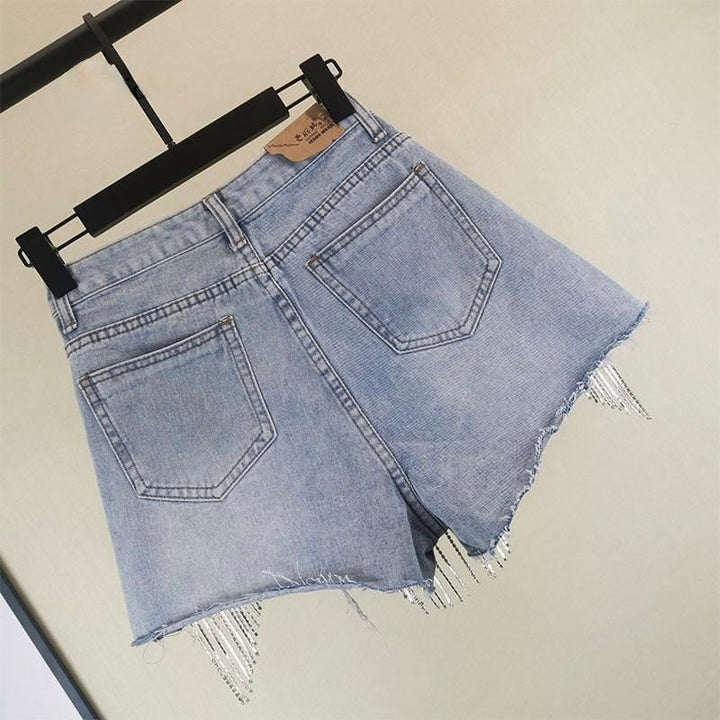 Stylish blue tassel shorts for women, a trendy fashion bottom for comfortable summer casual wear.