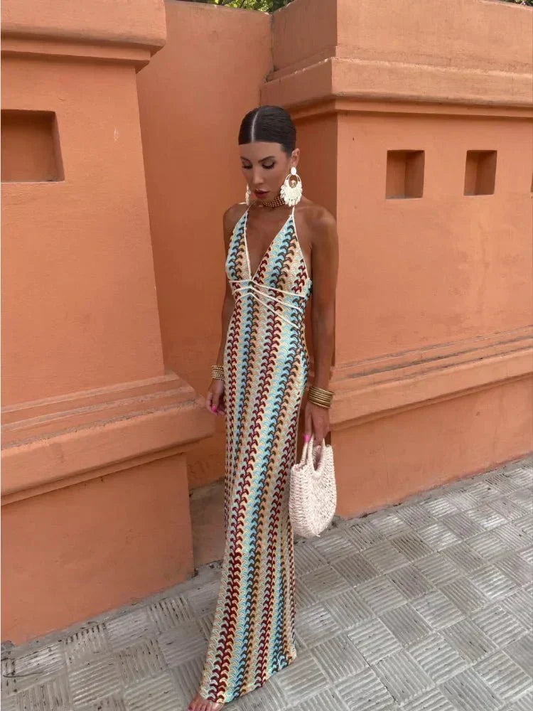 Vibrant boho print on a chic maxi dress for wedding guests. Elegant and stylish, ideal for summer parties.