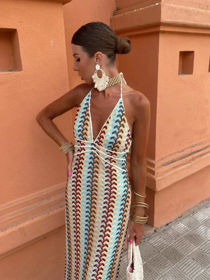 Elegant boho maxi wedding guest dress, chic v-neck and vibrant print. Perfect for summer vacations & parties.