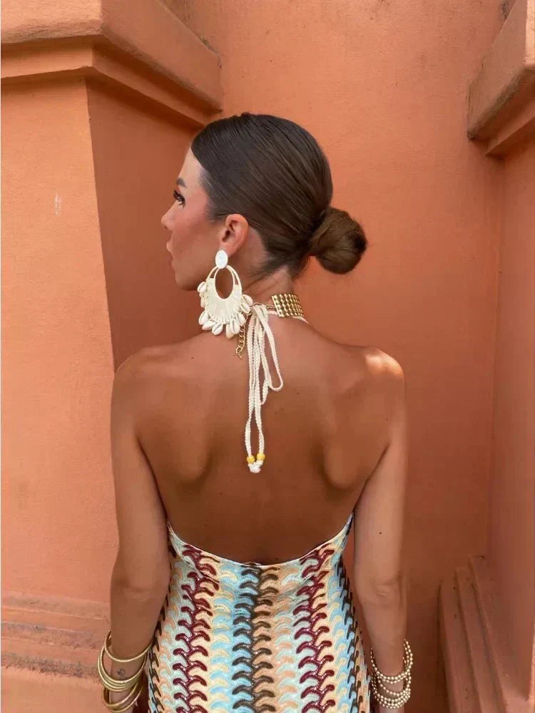 Flowy boho printed maxi dress, a chic and comfortable women's wedding guest option for warm summer events.
