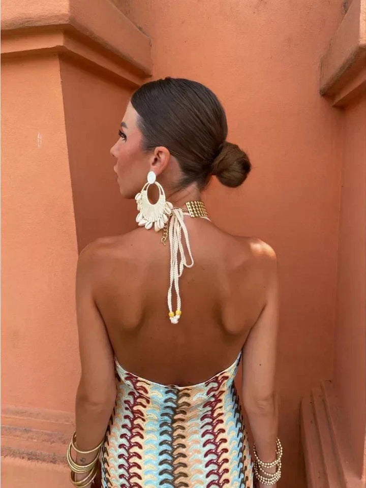 Flowy boho printed maxi dress, a chic and comfortable women's wedding guest option for warm summer events.