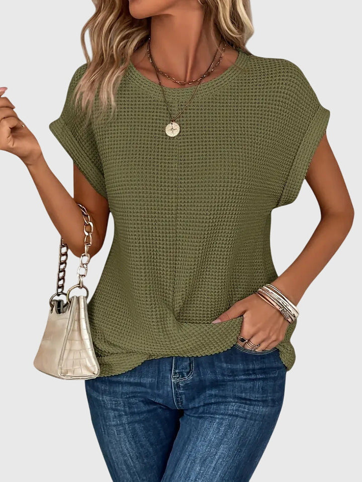 Stylish women's crew neck blouse, a versatile long sleeve fashion top adaptable for elegant workwear or casual chic.