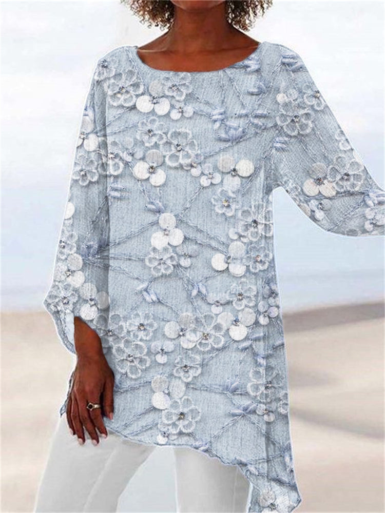 Women's stylish floral tunic with a round neck and asymmetrical hem. Perfect for chic, casual, long-sleeve wear.