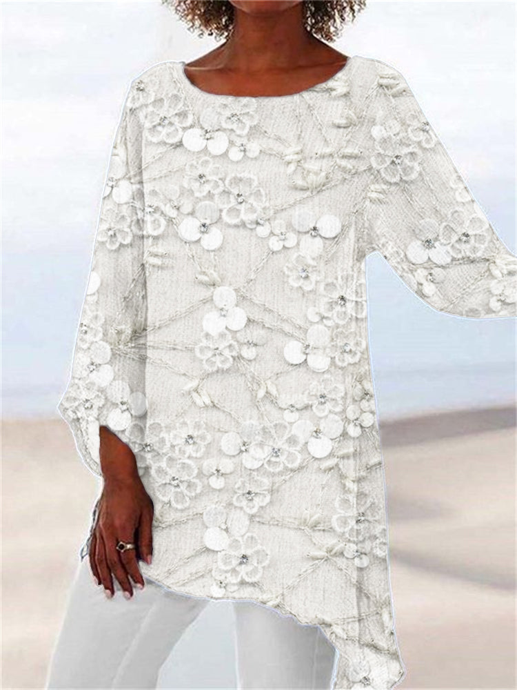 Relaxed fit women's tunic top featuring a vibrant floral pattern and trendy asymmetrical hem. Long sleeve for comfort.