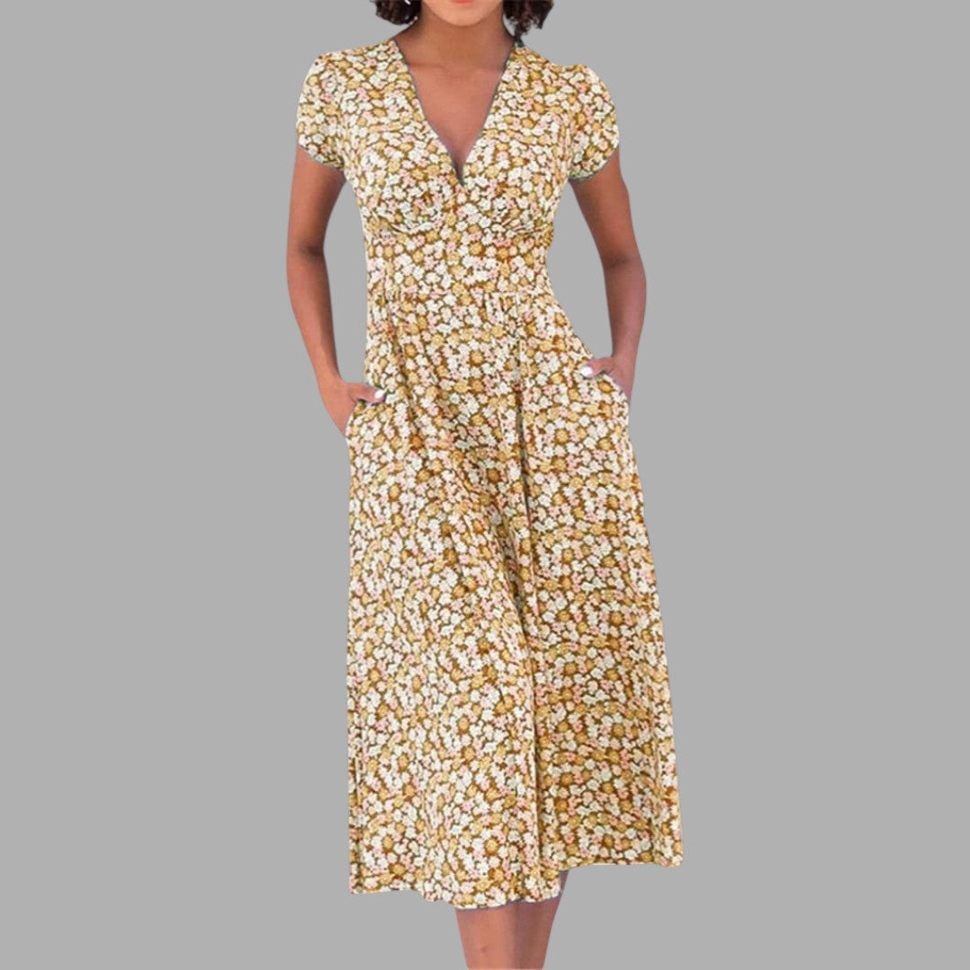 Vibrant floral print women's midi dress, designed with a V-neck, short sleeves, and discreet pockets for everyday style.