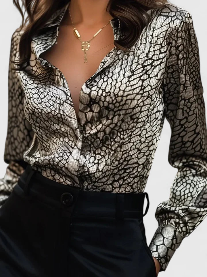 Stylish women's animal print blouse with a classic leopard pattern, long sleeves, and elegant collar.