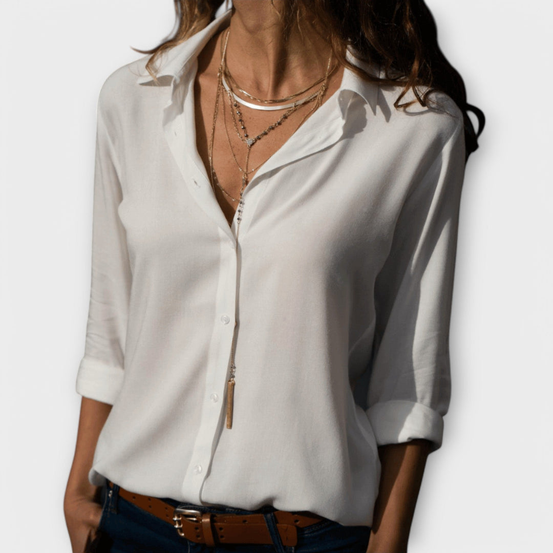 Chic women's long sleeve blouse, perfect for office workwear or elegant evening events. Versatile fashion top.