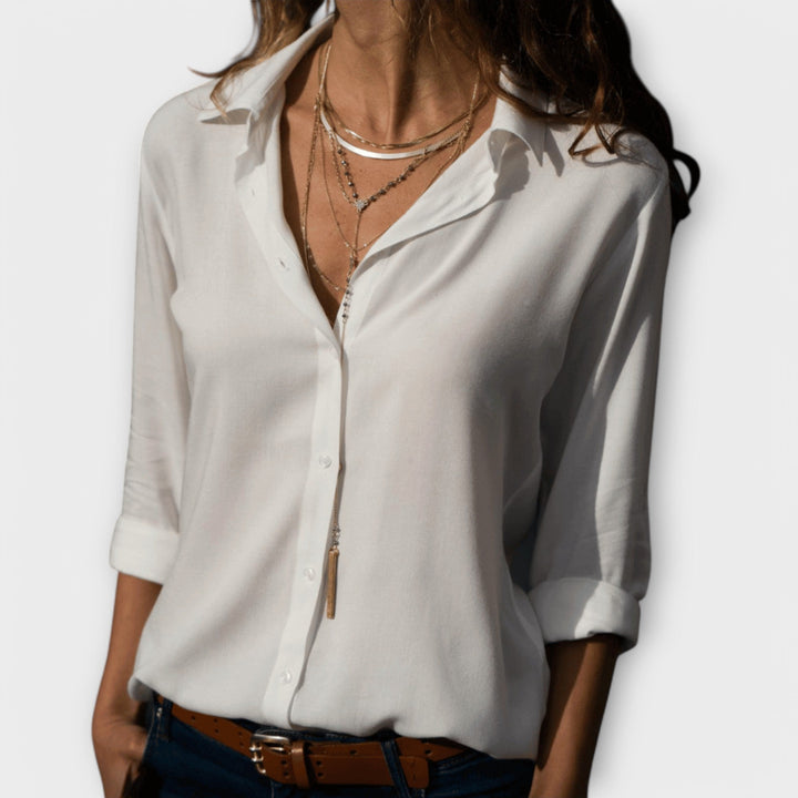 Chic women's long sleeve blouse, perfect for office workwear or elegant evening events. Versatile fashion top.