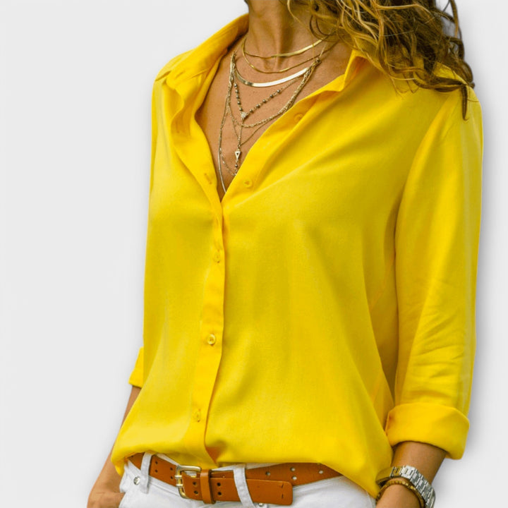 Stylish women's long sleeve blouse for a chic casual look or elegant office wear. A versatile fashion top for women.