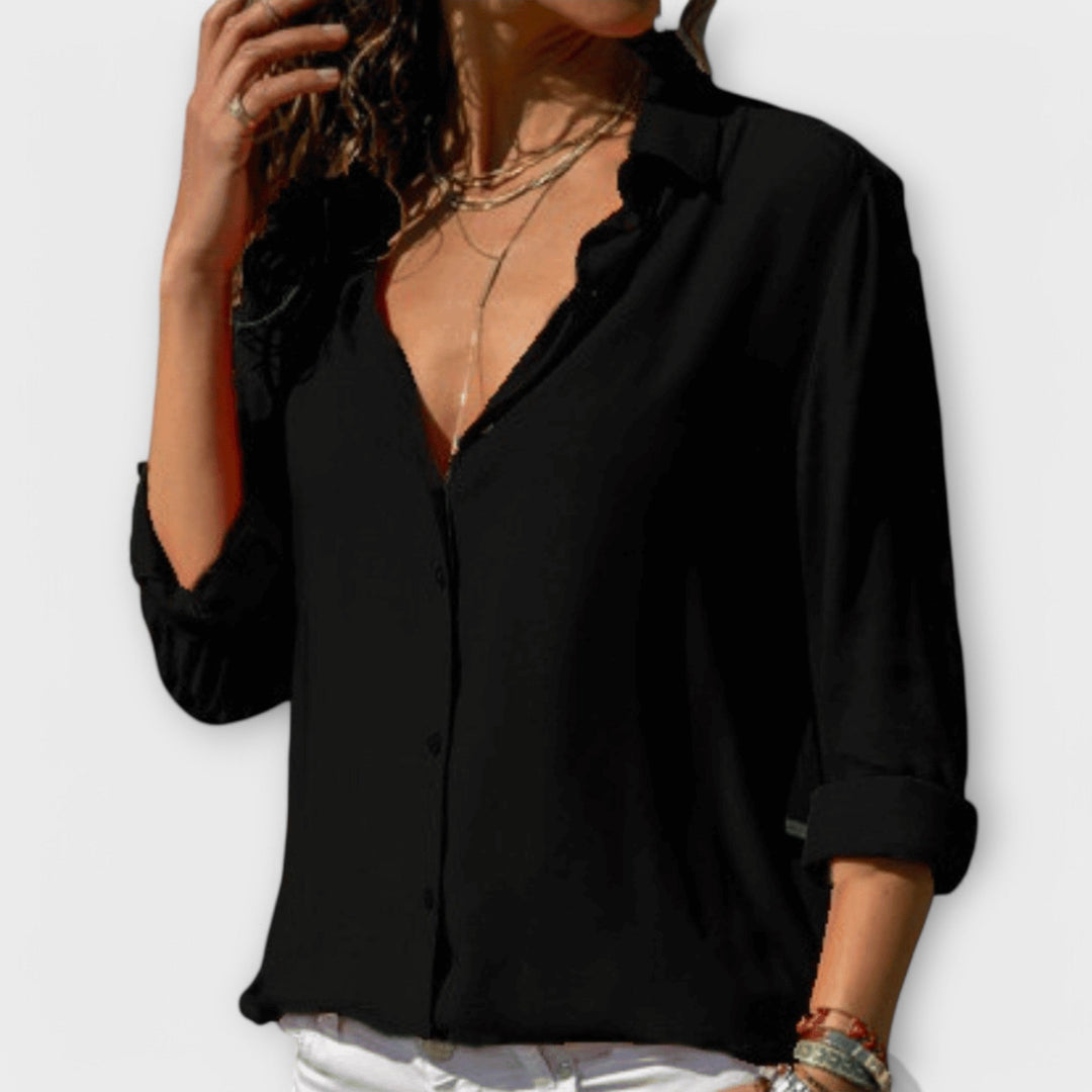 Elegant women's workwear blouse with long sleeves. Chic fashion top perfect for office professionals & evening wear.