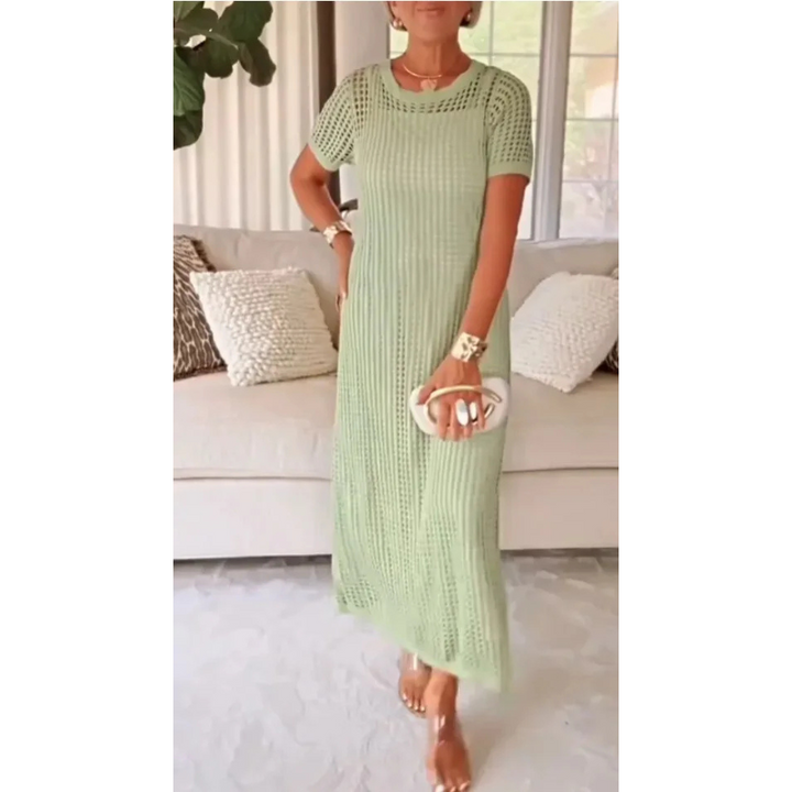 Straight cut women's open knit maxi dress. Elegant short sleeve mesh design for chic resort wear.