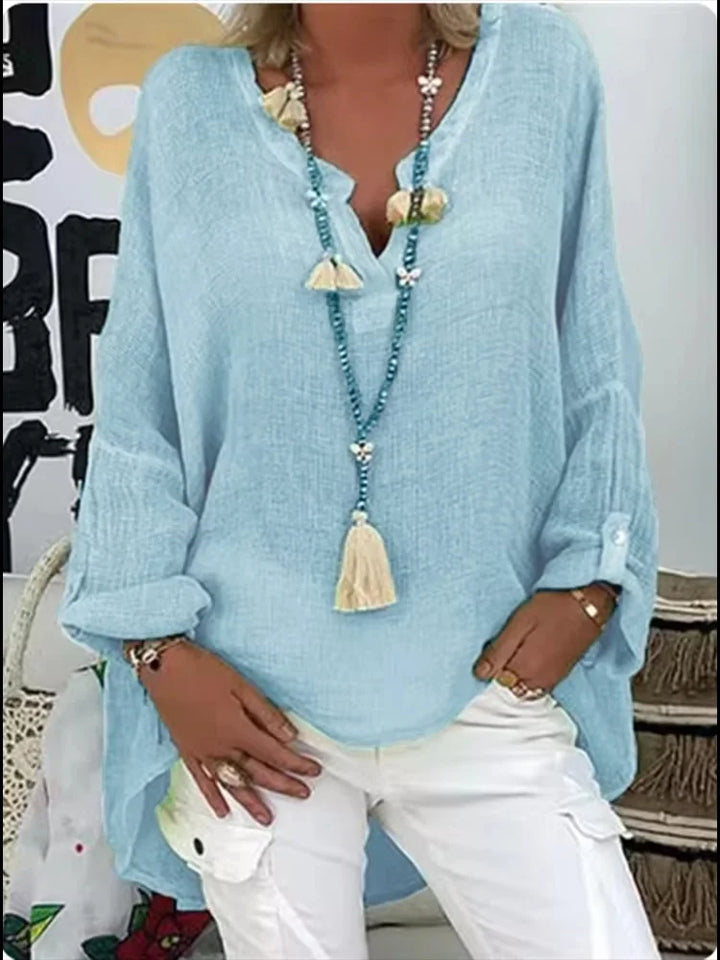 Chic women's oversized blouse, perfect for a relaxed yet elegant style. Versatile long sleeve top for casual or dressy wear.