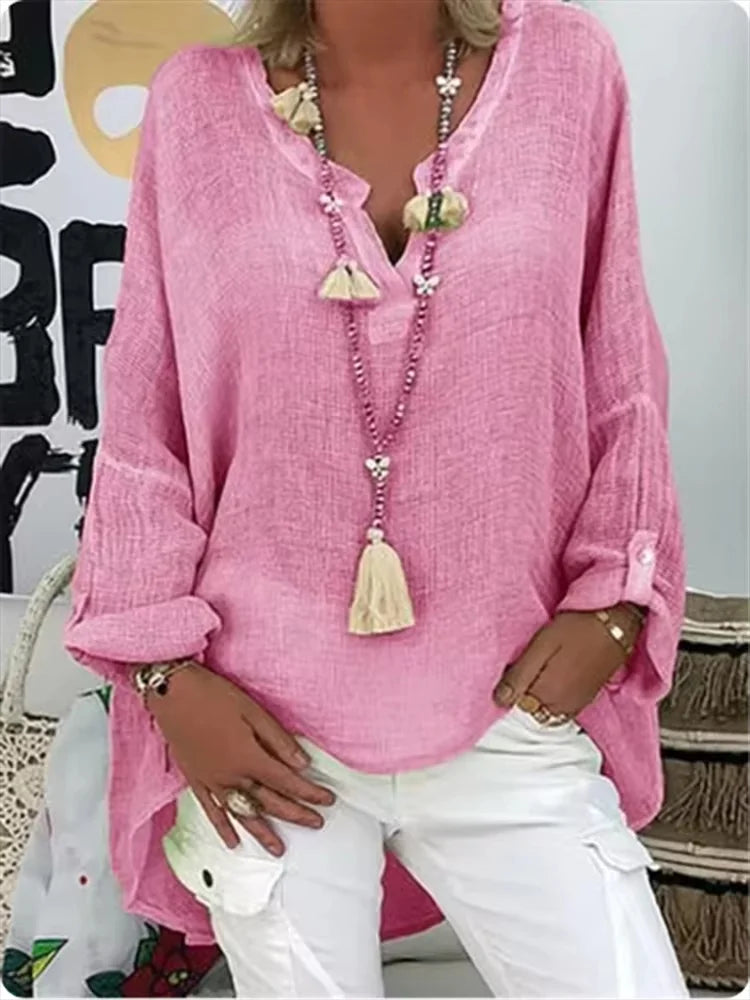 Effortless women's oversized blouse offering comfort and modern style. Ideal for casual chic outfits and summer layering.