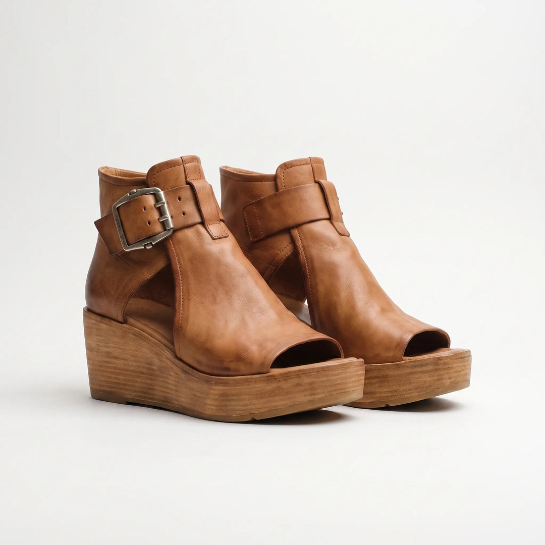 Stylish women's platform wedge sandals with peep toe and buckled ankle strap, great for elevated summer fashion.