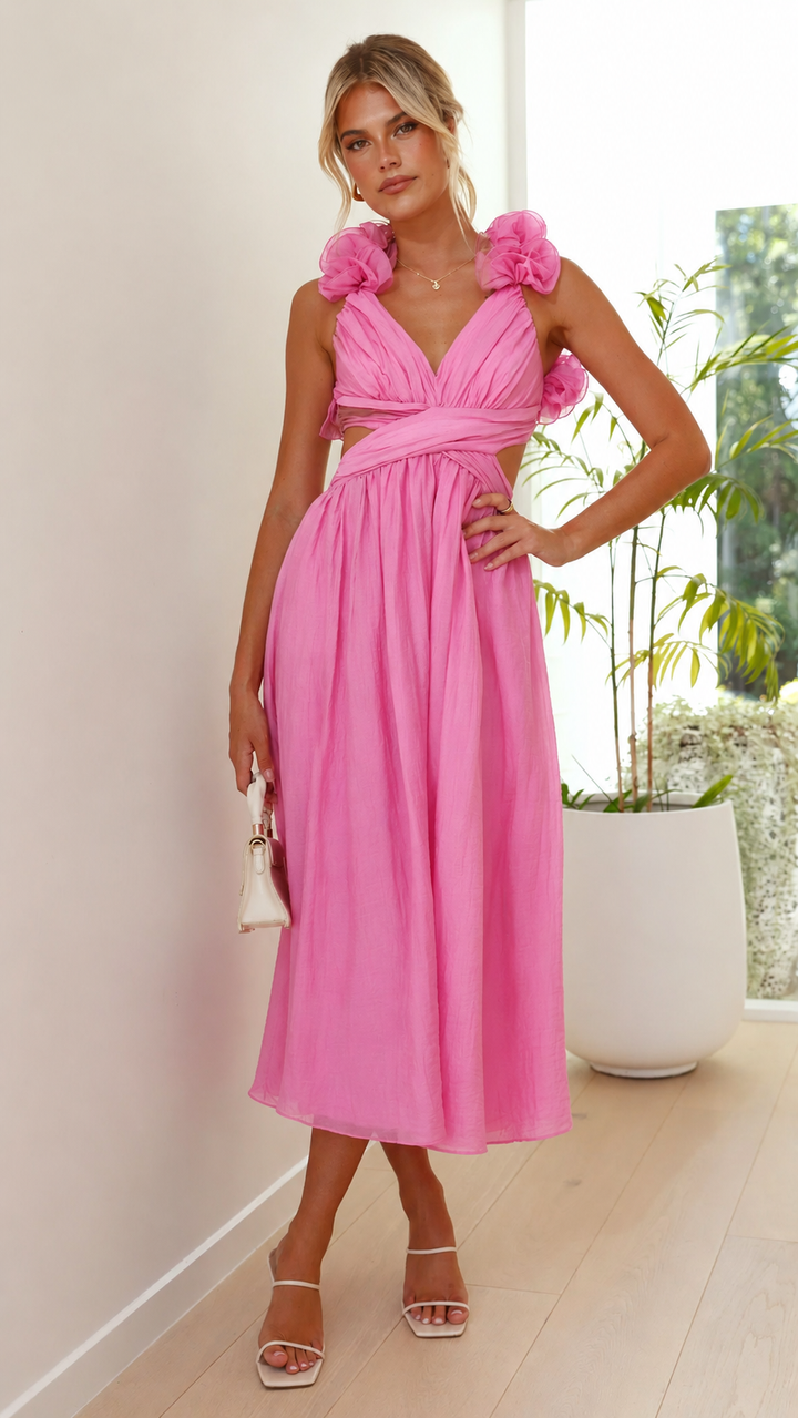 Full-length view of a beautiful women's pink maxi dress with ruffles, an elegant choice for summer weddings.