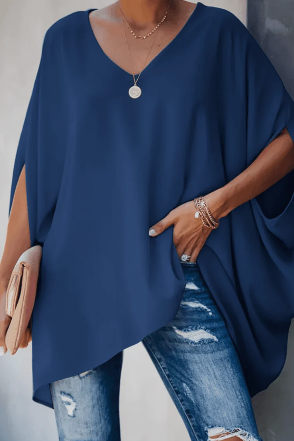 Elegant pleated v-neck blouse for women. Ideal for chic spring fashion, office or casual outings.