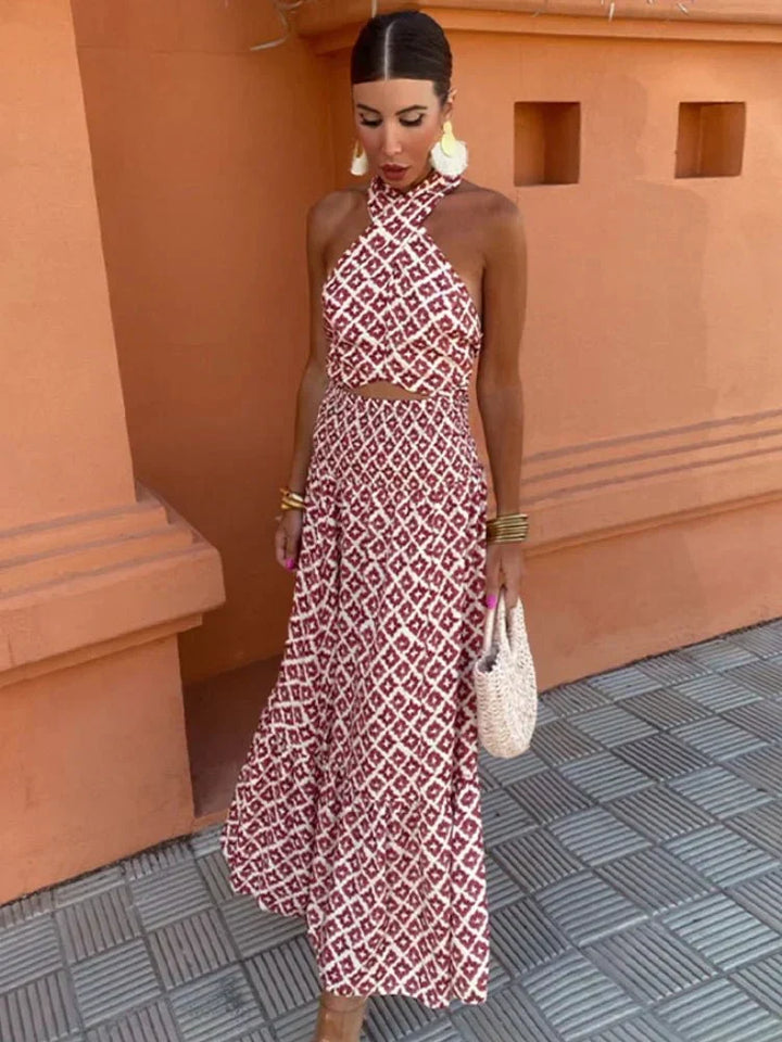 Chic women's printed halter maxi dress, perfect for wedding guests & formal special occasions. Elegant evening wear.