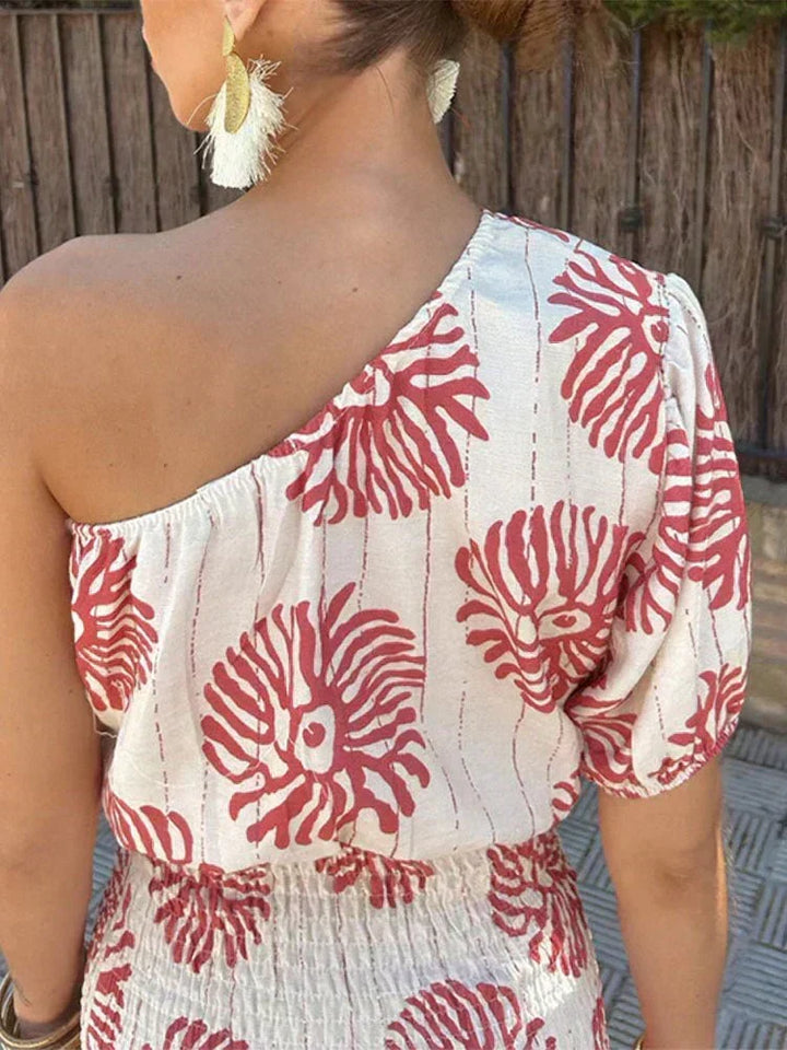 Stylish printed one-shoulder mini dress for women. A chic choice for wedding guests, summer events, or vacation wear.