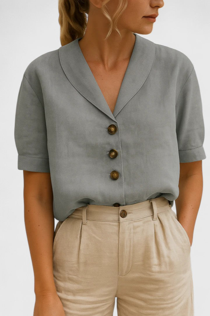 Elegant neutral women's blouse with a sophisticated button-up design. A versatile top, ideal for chic workwear or stylish casual outfits.