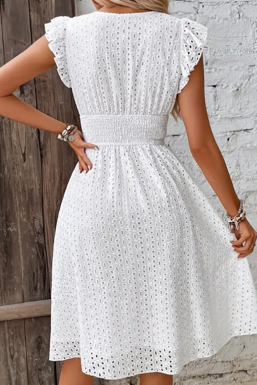 Model wearing a chic strapless textured midi dress for women, showcasing its elegant fit, ideal for evening parties.