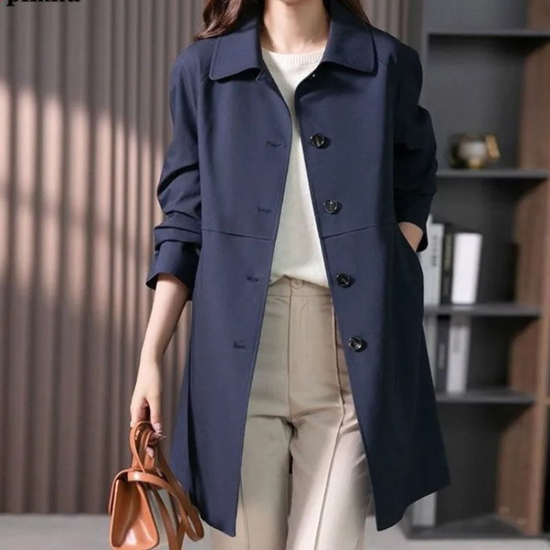 Modern women's tailored trench coat with a single-button closure. Versatile and chic for office or everyday fashion.