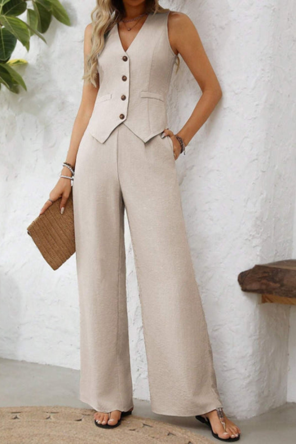 Elegant women's tailored set featuring a stylish vest and comfortable wide-leg trousers. Business chic.