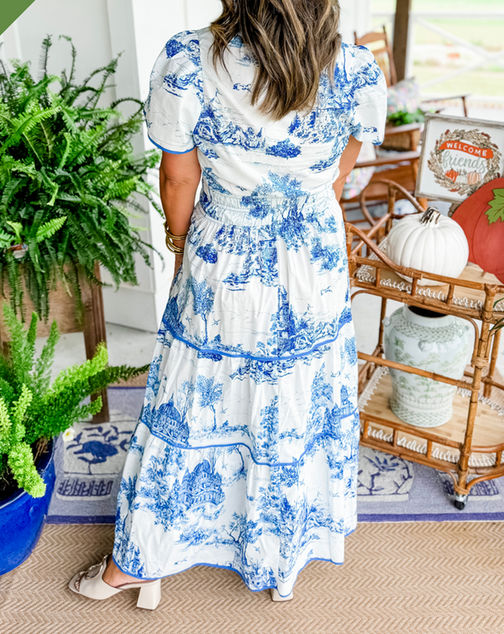 Stylish women's printed tiered maxi dress, perfect as a wedding guest outfit or elegant garden party attire.