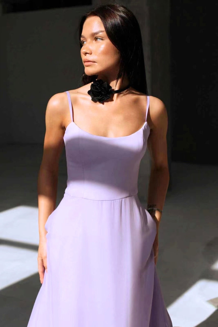 Women's elegant summer twirl dress. Chic flowing design, perfect for wedding guests & special occasions.