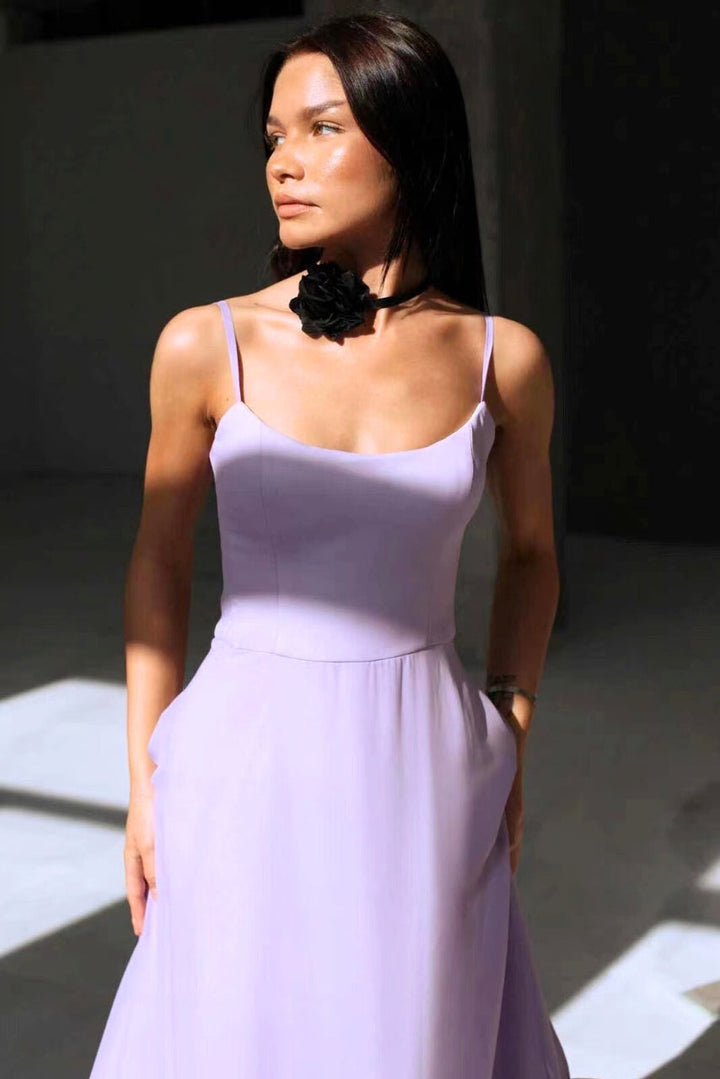 Women's elegant summer twirl dress. Chic flowing design, perfect for wedding guests & special occasions.