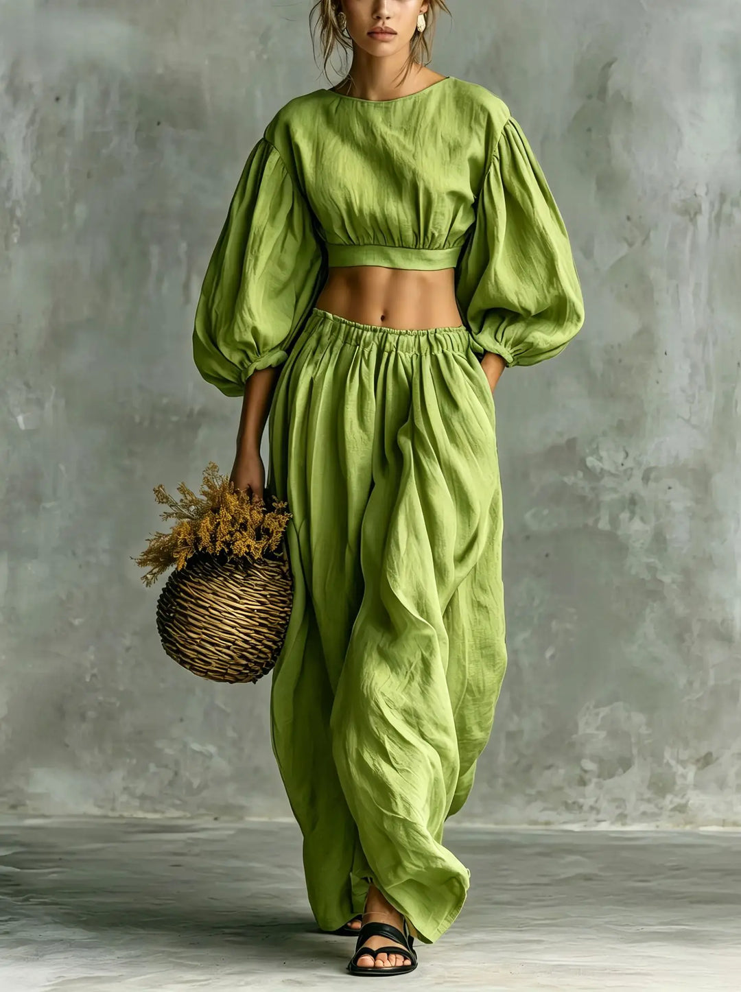 Modern women's balloon sleeve two-piece trouser set. Stylish, relaxed fit outfit with wide-leg pants for comfort.