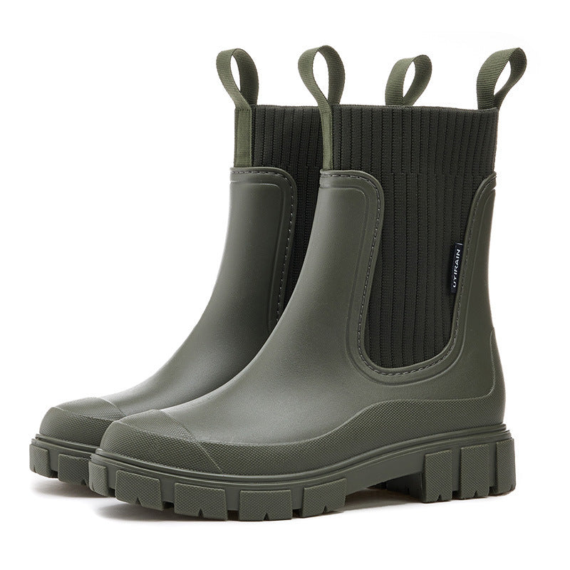 Side view of women's chic waterproof all-weather boots. Elegant design and practical protection for any forecast.