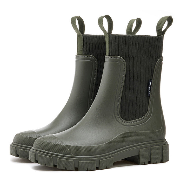 Side view of women's chic waterproof all-weather boots. Elegant design and practical protection for any forecast.