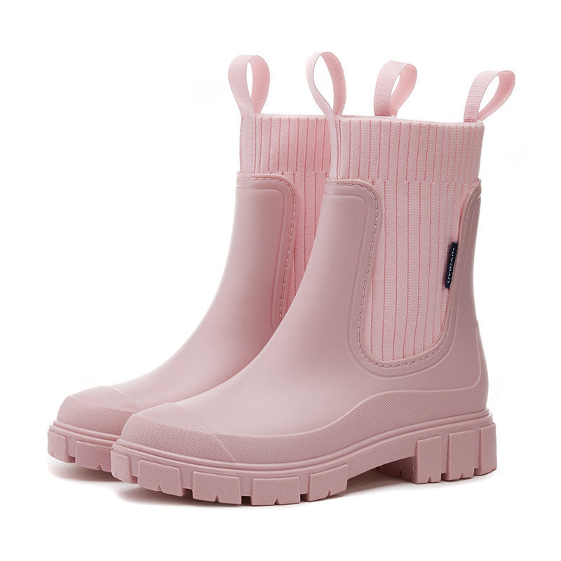 Back view of comfortable women's waterproof all-weather boots, designed for a snug fit & dry outdoor adventures.