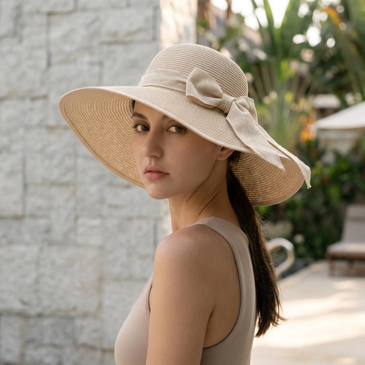 Chic women's wide brim sun hat, foldable & perfect for beach, travel, and summer style. Your vacation essential.
