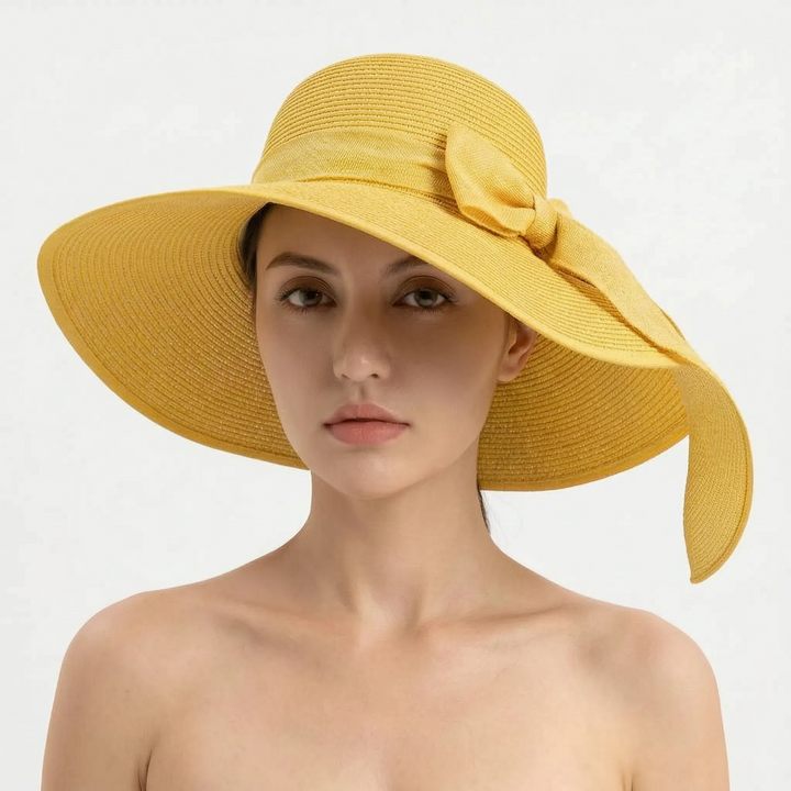 Women's foldable sun hat with a wide brim, a practical beach hat & chic travel accessory for summer.