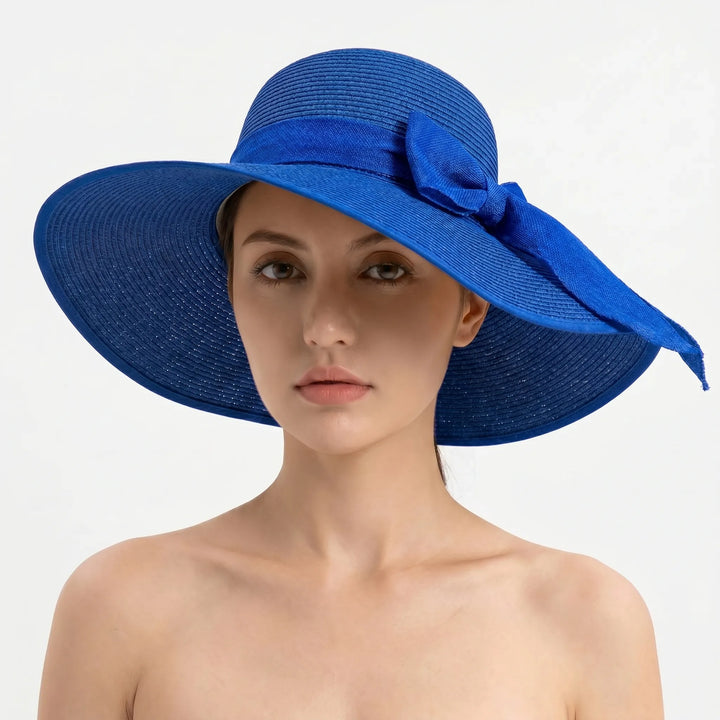 Vacation essential: Women's wide brim sun hat, foldable for travel. Enjoy sunny days in chic summer style.