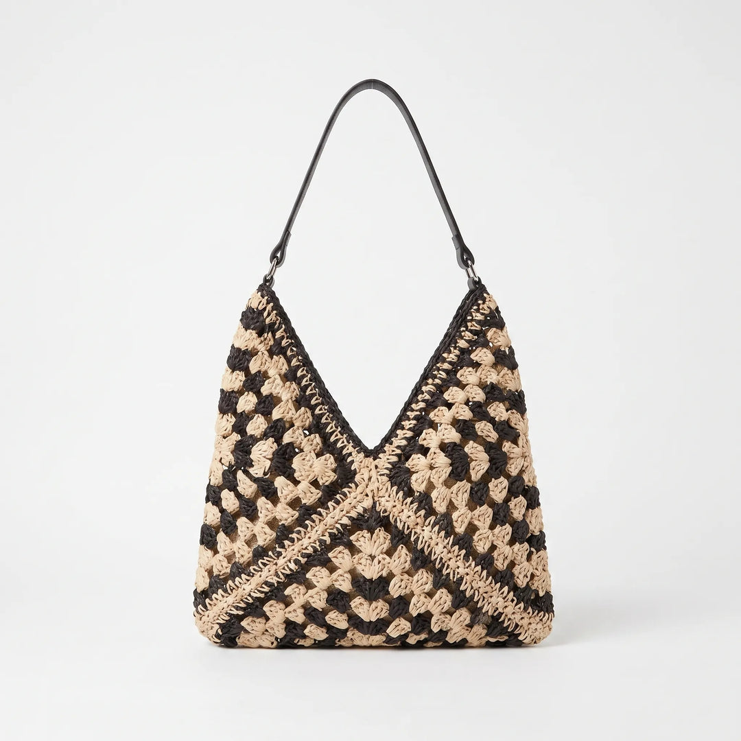 Stylish woven shoulder tote bag for women. Perfect as a summer beach bag or a casual everyday travel accessory.