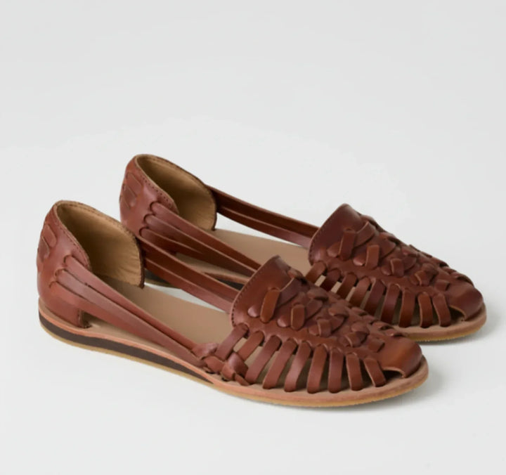 Comfortable women's orthopedic mules, featuring a stylish woven design for easy slip-on wear and everyday support.