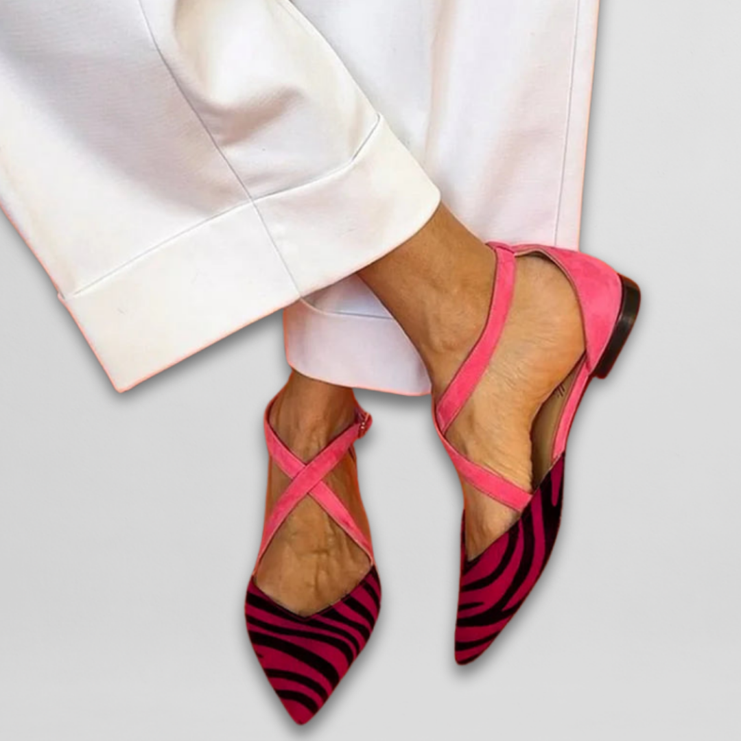 Fashionable women's strappy zebra print flats, chic and comfortable for summer style.