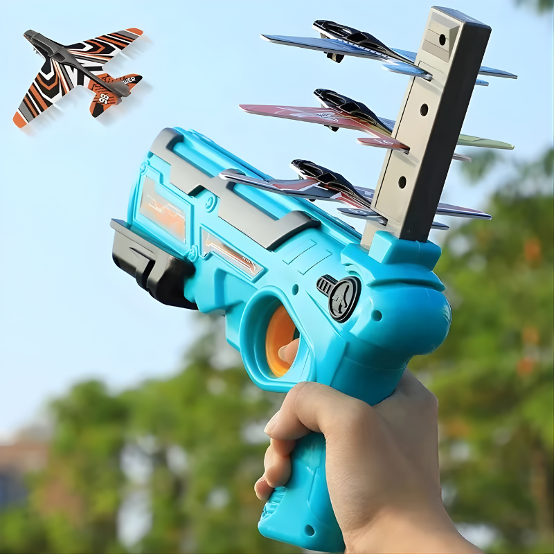 Child joyfully launching a bright foam plane toy outdoors with a blue launcher, promoting active fun and coordination.