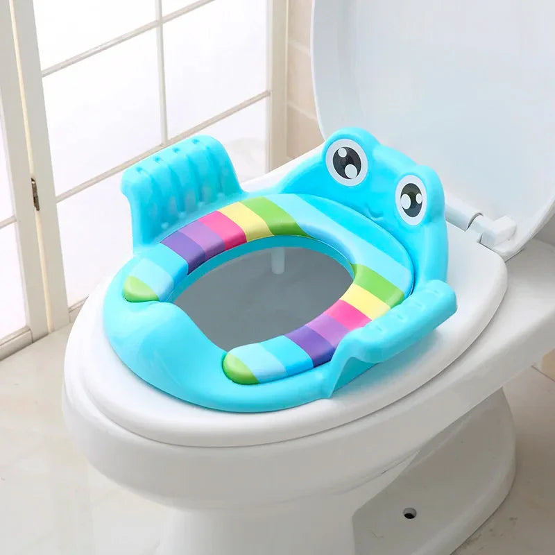 Child's cushioned potty training seat with handles, white and blue, for toddlers learning to use the toilet