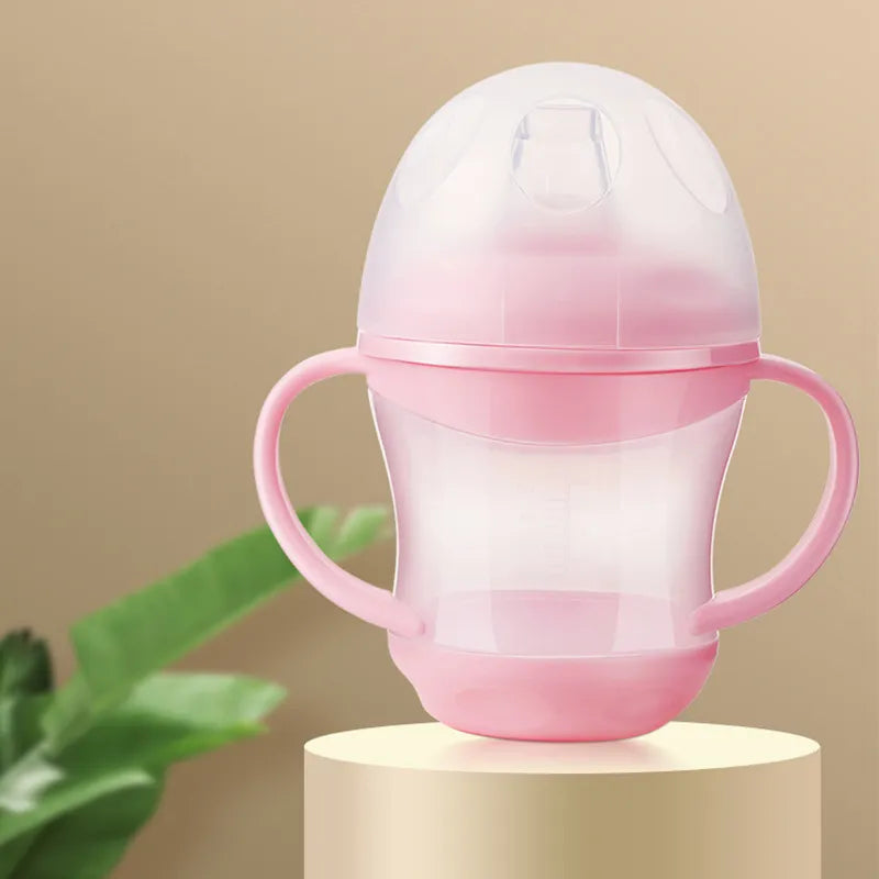 Baby essentials water bottle, clear, with a secure lid and side handle for small hands