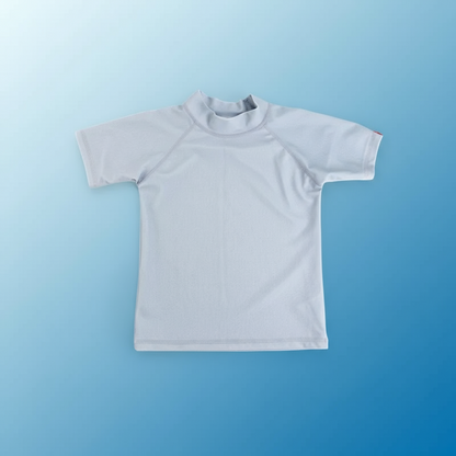 Child's rash guard with playful ocean print, offering stylish sun protection.