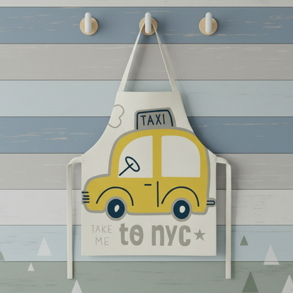 Vehicle-patterned children's apron spread out, highlighting its practical and fun features