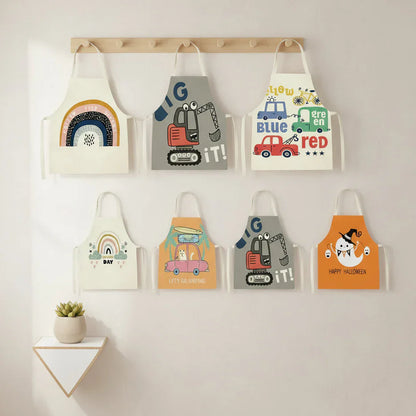 Playful children's apron with vehicle patterns, offering spill protection for little chefs