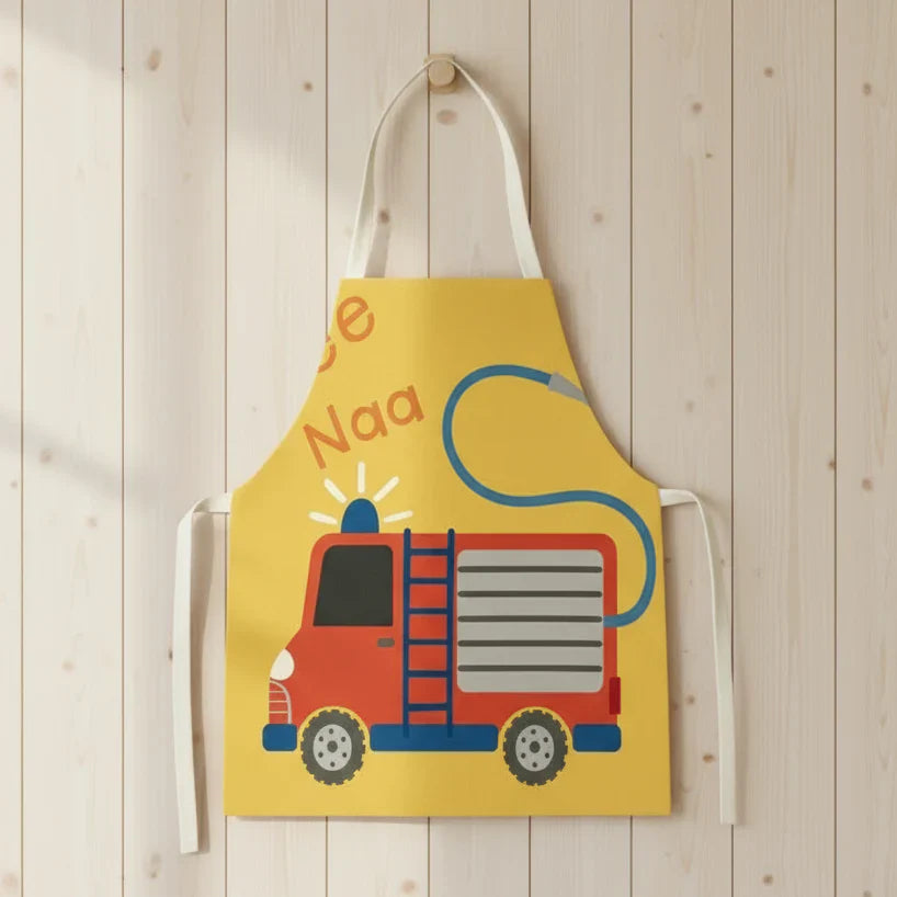 Children's kitchen apron with colorful vehicles, designed for messy playtime fun