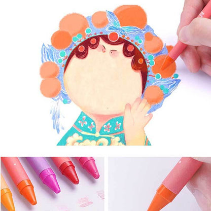 Close-up of a child's hands holding crayons and paper from a children's drawing kit