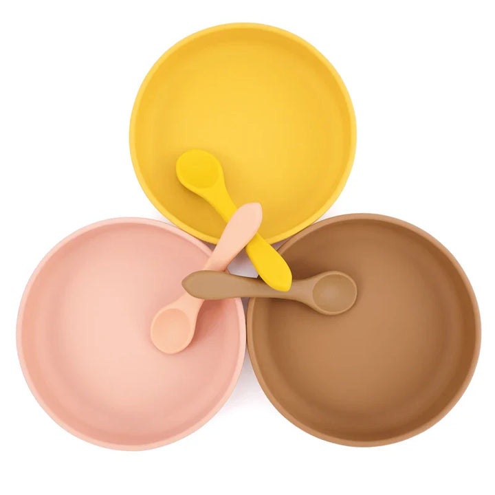 Green silicone toddler bowl with strong suction base, safe and BPA-free for messy eaters.