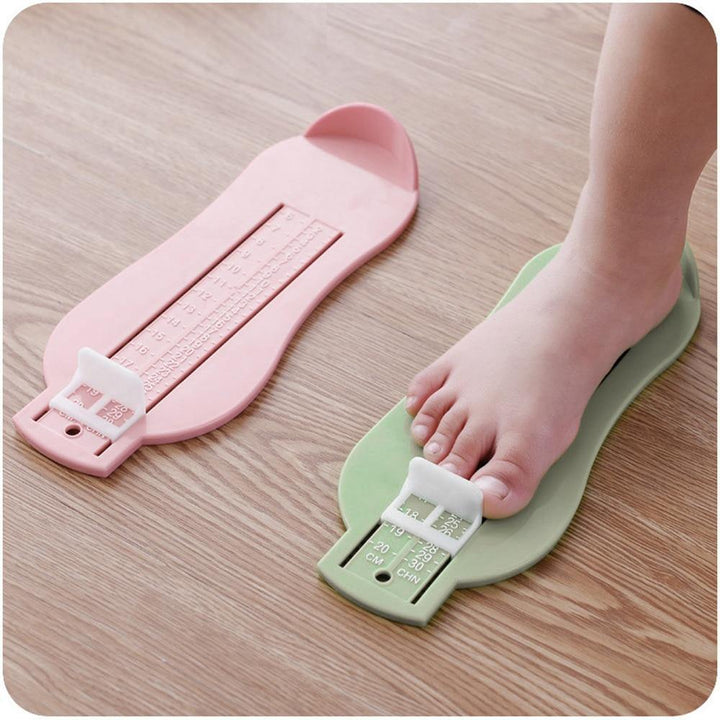 Green kids shoe sizer, perfect for precise foot measurement and tracking child's foot growth.